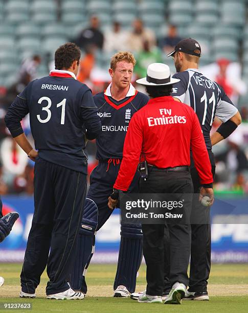 Daniel Vettori captain of New Zealand talks to Paul Collingwood of England during the ICC Champions Trophy Group B match between England and New...