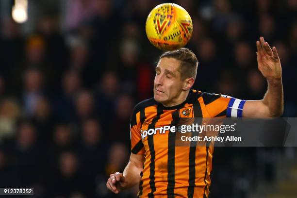 Michael Dawson of Hull City heads the ball out of the box during the Sky Bet Championship match between Hull City and Leeds United at the KCOM...