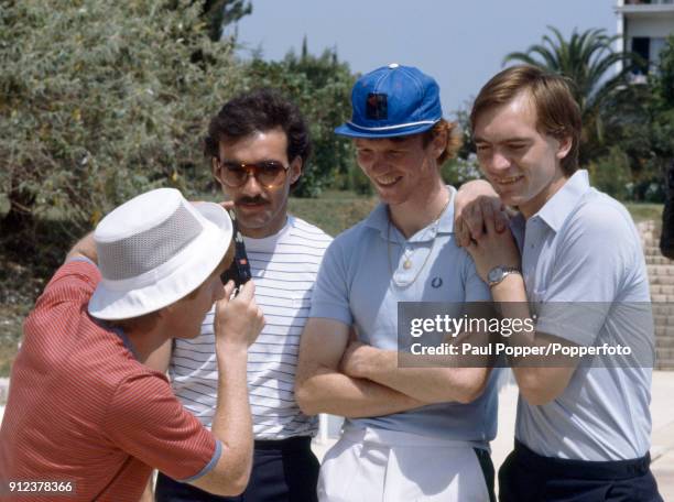 Scotland's Gordon Strachan snaps his Aberdeen team-mates, Willie Miller, Alex McLeish and Jim Leighton as the team prepares for their FIFA World Cup...