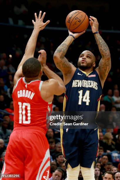 Jameer Nelson of the New Orleans Pelicans shoots over Eric Gordon of the Houston Rockets during a NBA game at the Smoothie King Center on January 26,...