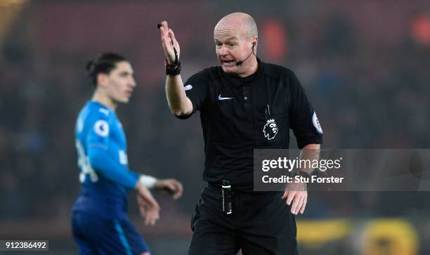 Referee Lee Mason reacts during the Premier League match between Swansea City and Arsenal at Liberty Stadium on January 30, 2018 in Swansea, Wales.