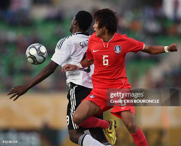 South Korea's defender Jeong Ho Hong jumps for the ball as he competes with German midfielder Richard Sukuta-Pasu during their Group C FIFA U-20...