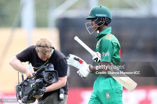 Hasan Mahmud of Bangladesh comes from the field after being dismissed during the ICC U19 Cricket World Cup 5th Playoff match between South Africa and...