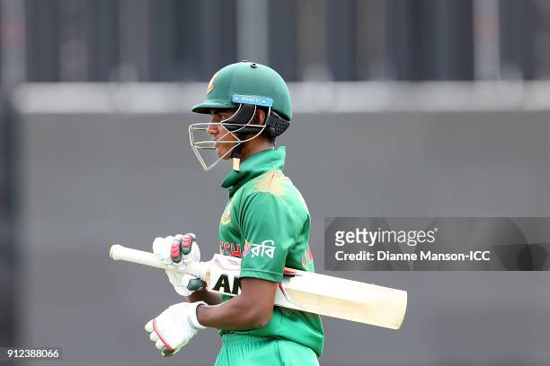 Hasan Mahmud of Bangladesh comes from the field after being dismissed during the ICC U19 Cricket World Cup 5th Playoff match between South Africa and...
