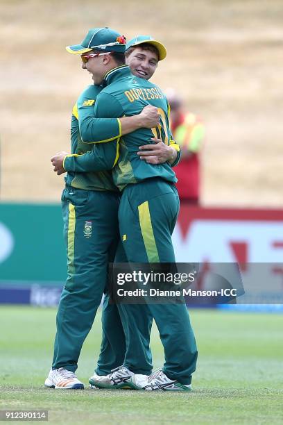 Raynard van Tonder and Jean du Plessis of South Africa celebrate the dismissal of Hasan Mahmud of Bangladesh during the ICC U19 Cricket World Cup 5th...