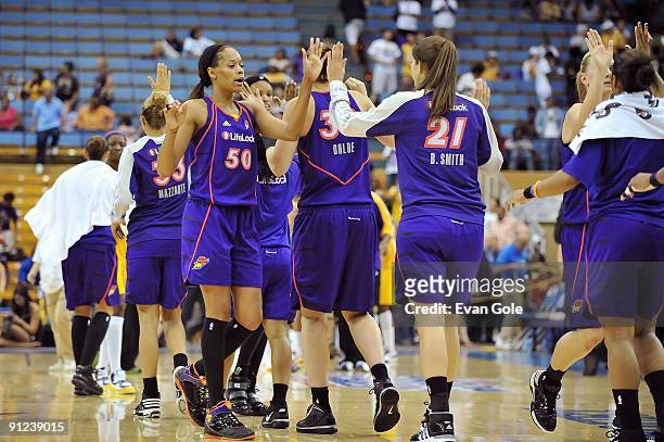 Tangela Smith of the Phoenix Mercury celebrates with teammates in Game One of the Western Conference Finals against the Los Angeles Sparks during the...