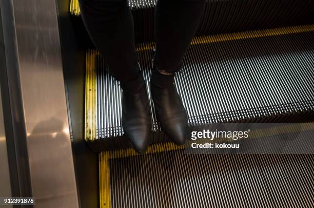 Feet On Escalator Photos and Premium High Res Pictures - Getty Images
