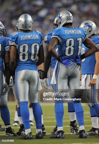 Bryant Johnson and Calvin Johnson of the Detroit Lions stand in the huddle against the Washington Redskins at Ford Field on September 27, 2009 in...