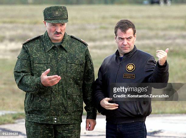 Russian President Dmitry Medvedev and Belarusian President Alexander Lukashenko arrive at the military polygon to watch combined military exercises...