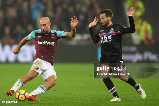 Pablo Zabaleta of West Ham United is challenged by Yohan Cabaye of Crystal Palace during the Premier League match between West Ham United and Crystal...