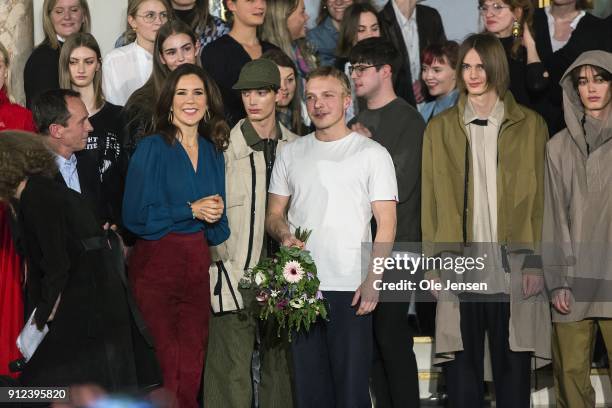 Crown Princess Mary of Denmark with winner Axel Enqvist at Designers' Nest award show for young designers during Copenhagen Fashion Week...