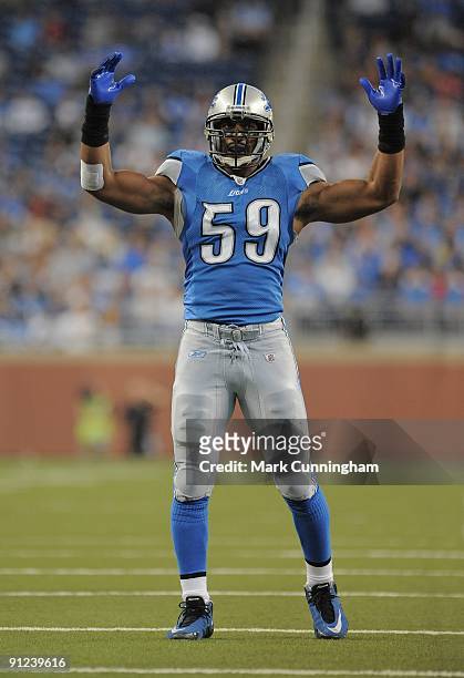 Julian Peterson of the Detroit Lions raises his arms in the air after a play against the Washington Redskins at Ford Field on September 27, 2009 in...