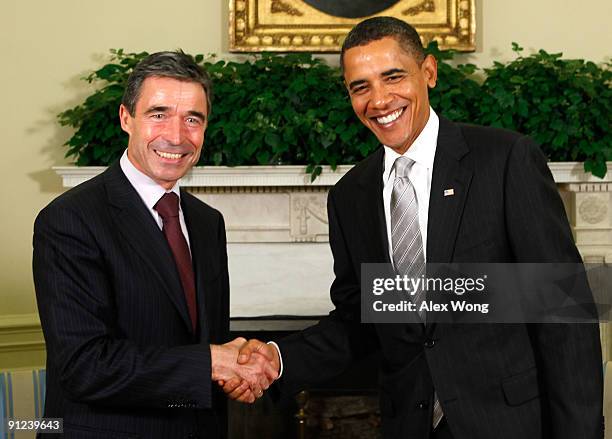 President Barack Obama shakes hands with NATO Secretary General Anders Fogh Rasmussen in the Oval Office at the White House September 29, 2009 in...