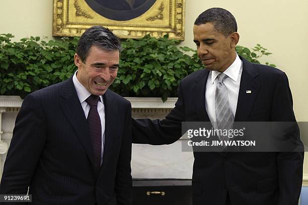 President Barack Obama meets with NATO Secretary General Anders Fogh Rasmussen in the Oval Office of the White House in Washington on September 29,...