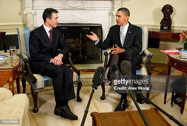 President Barack Obama speaks as NATO Secretary General Anders Fogh Rasmussen looks on in the Oval Office at the White House September 29, 2009 in...