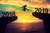 A man jump between 2018 and 2019 years.