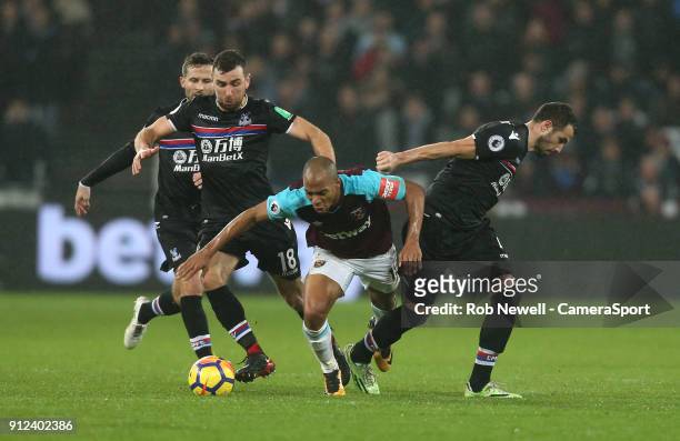West Ham United's Joao Mario gets in between Crystal Palace's James McArthur, Yohan Cabaye and Luka Milivojevic during the Premier League match...