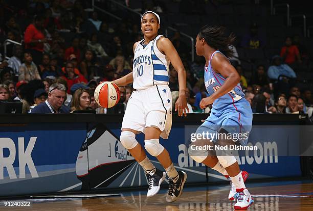 Lindsey Harding of the Washington Mystics moves the ball against Ivory Latta of the Atlanta Dream during the game at the Verizon Center on September...