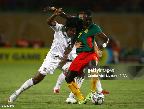 Sheanon Williams of USA tackles Olivier Boumale of Cameroon during the FIFA U20 World Cup Group C match between USA and Cameroon at the Mubarak...