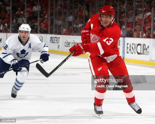 Pavel Datsyuk of the Detroit Red Wings shoots the puck during a NHL pre-season game against the Toronto Maple Leafs at Joe Louis Arena on September...
