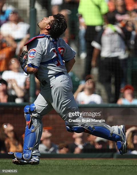 Geovany Soto of the Chicago Cubs chases a foul ball against the San Francisco Giants during the game at AT&T Park on September 26, 2009 in San...