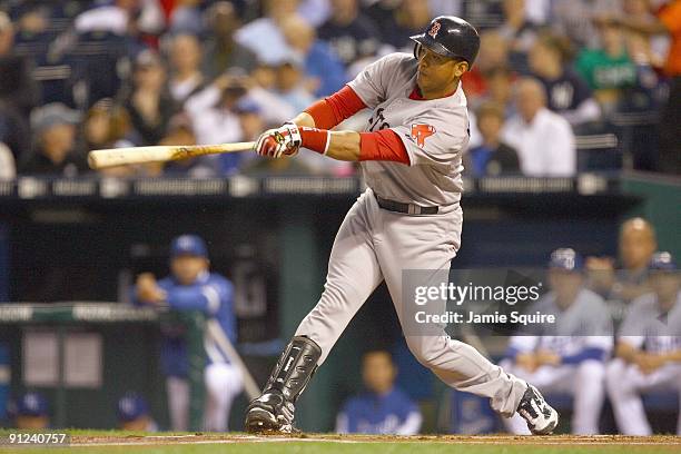 Victor Martinez of the Boston Red Sox swings at the pitch during the game against the Kansas City Royals on September 24, 2009 at Kauffman Stadium in...