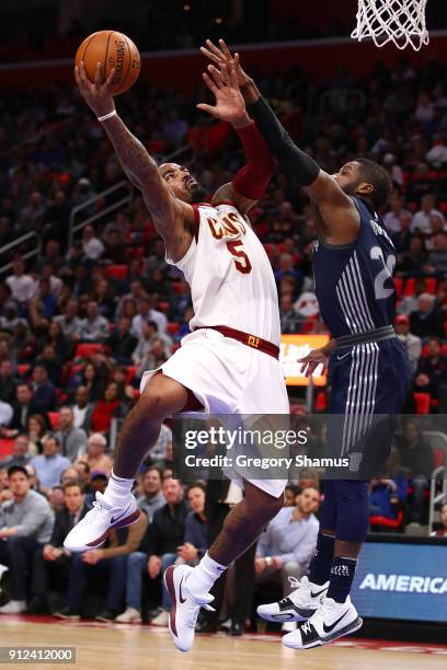 Smith of the Cleveland Cavaliers tries to get a shot off past Dwight Buycks of the Detroit Pistons during the first half at Little Caesars Arena on...