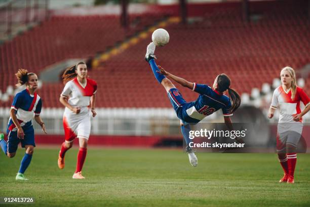 determined bicycle kick on a soccer match! - bicycle kick stock pictures, royalty-free photos & images