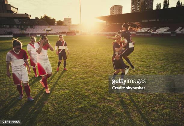 winning vs. loosing on women's soccer match! - sad football player stock pictures, royalty-free photos & images
