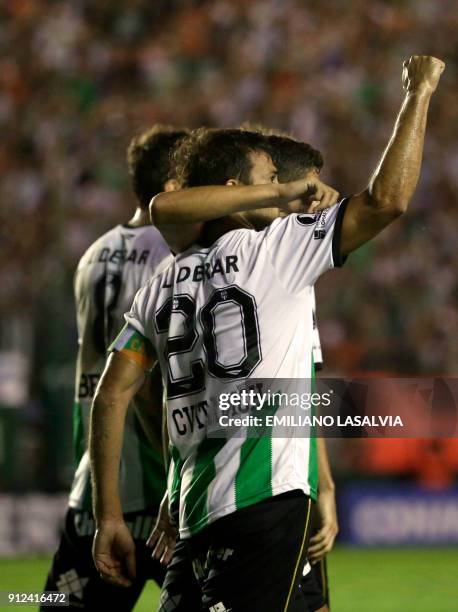 Argentina's Banfield Dario Cvitanich celebrates with teammates after scoring against Ecuador's Independiente del Valle during the Copa Libertadores...