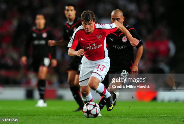 Andrey Arshavin of Arsenal runs with the ball during the UEFA Champions League Group H match between Arsenal and Olympiakos at the Emirates Stadium...