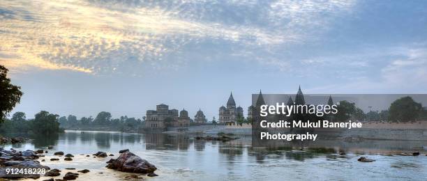 the chattris or cenotaphs in orchaa were built to honour the dead ancestors of the bundela rajas, orchha, madhya pradesh, india - orchha imagens e fotografias de stock