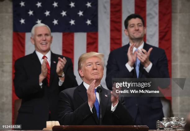 President Donald J. Trump claps along with U.S. Vice President Mike Pence and Speaker of the House U.S. Rep. Paul Ryan during the State of the Union...