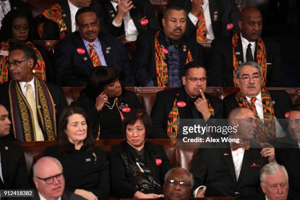 Members of Congress wear black clothing and Kente cloth in protest during the State of the Union address in the chamber of the U.S. House of...