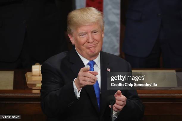 President Donald J. Trump points during the State of the Union address in the chamber of the U.S. House of Representatives January 30, 2018 in...