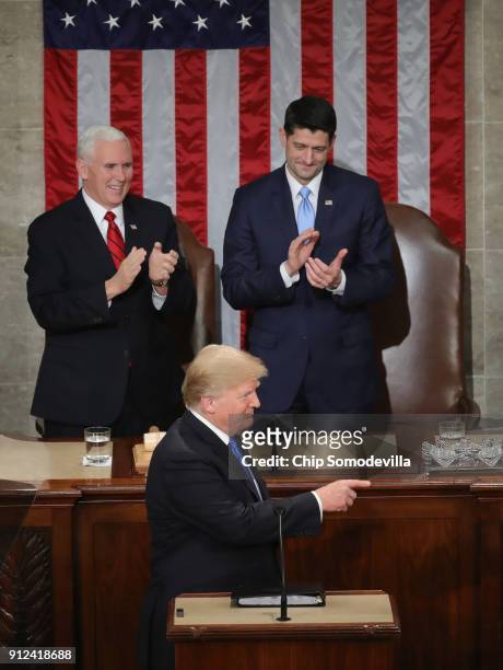 President Donald J. Trump points as U.S. Vice President Mike Pence and Speaker of the House U.S. Rep. Paul Ryan look on during the State of the Union...