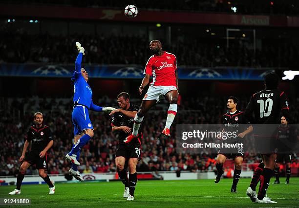 William Gallas of Arsenal jumps for the ball during the UEFA Champions League Group H match between Arsenal and Olympiakos at the Emirates Stadium on...