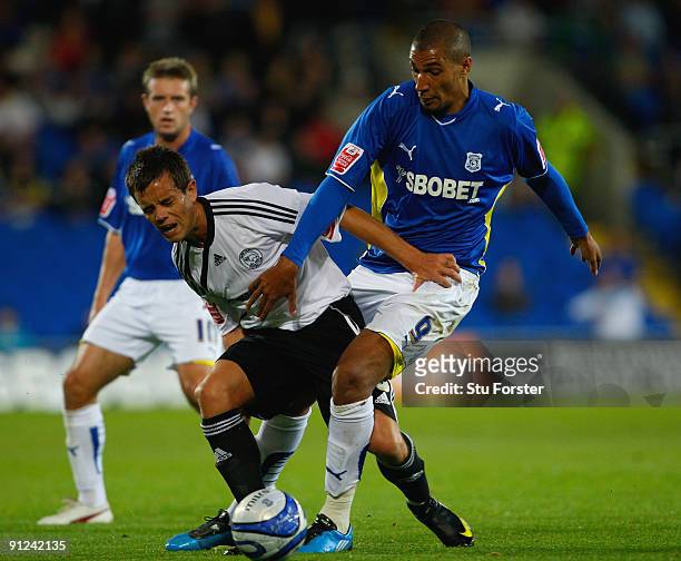 Cardiff player Jay Bothroyd is tackled by Lee Hendrie of Derby during the Coca-Cola Championship match between Cardiff City and Derby County at the...