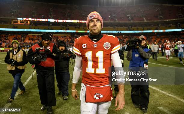 Kansas City Chiefs quarterback Alex Smith walks off the field after the Chiefs lost to the Tennessee Titans, 22-21, on January 6 during the AFC Wild...