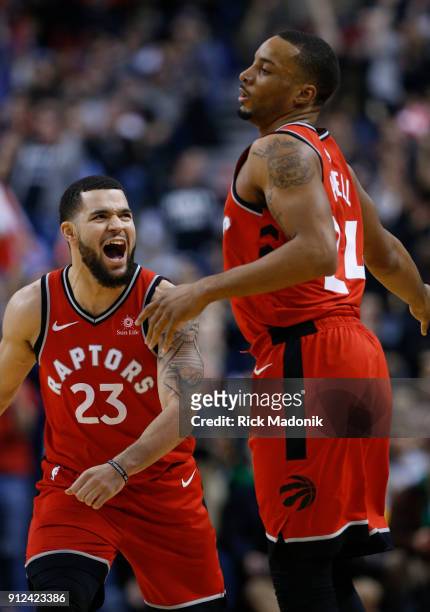 Toronto Raptors guard Fred VanVleet celebrates with Toronto Raptors forward Norman Powell after Powell knocked down a three pointer to put the...