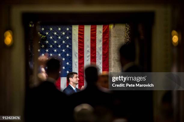 Speaker of the House Paul Ryan applaudes as the chamber recognizes First Lady Melania Trump before President Donald Trump's first State of the Union...