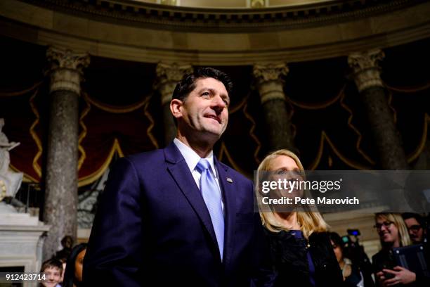 Speaker of the House Paul Ryan and his wife, Janna, make their way to the House of Representatives Chamber for President Donald Trump's first State...