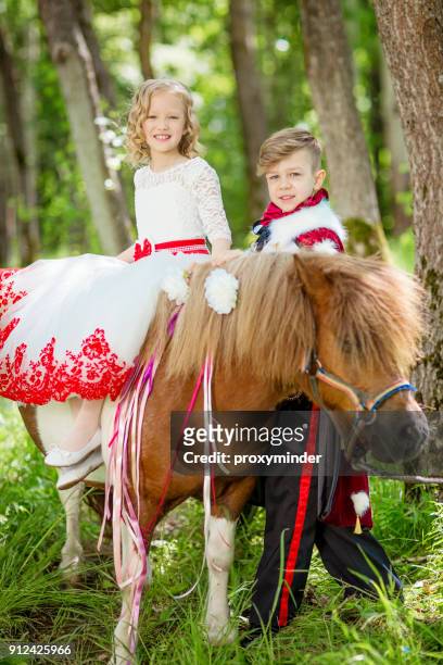 cinderella and prince with pony - latvia girls stock pictures, royalty-free photos & images
