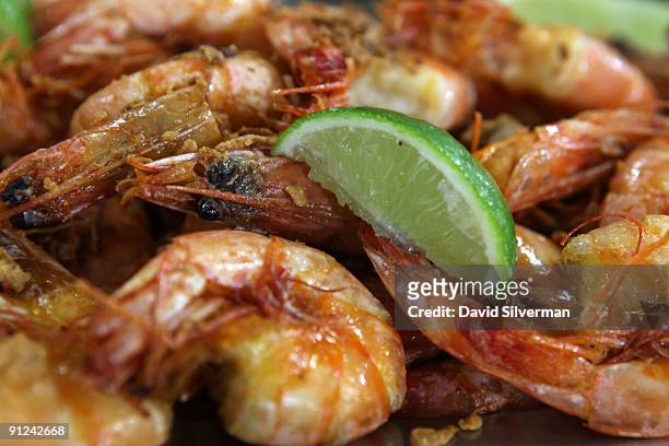 Fresh fried prawns are served with a wedge of lime at a fisherman's cafe in the Mercado São Pedro, the St. Peter's fresh fish market, on August 5,...