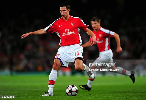 Robin van Persie of Arsenal in action during the UEFA Champions League Group H match between Arsenal and Olympiakos at the Emirates Stadium on...