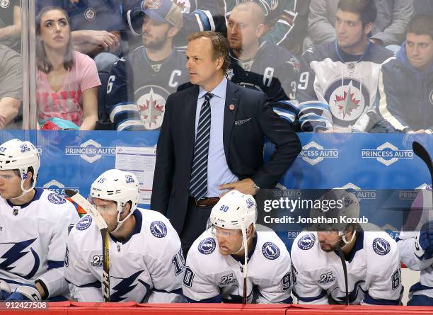 Head Coach Jon Cooper looks on from the bench during second period action against the Winnipeg Jets at the Bell MTS Place on January 30, 2018 in...