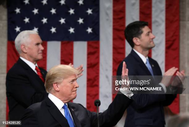 President Donald Trump delivers the State of the Union address as US Vice President Mike Pence and Speaker of the House US Rep. Paul Ryan look on in...