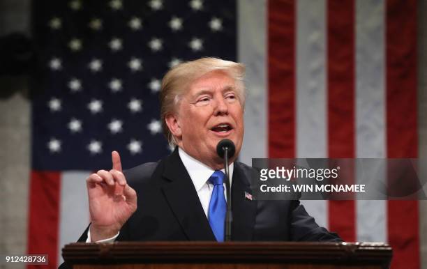 President Donald Trump gestures during the State of the Union address in the chamber of the US House of Representatives in Washington, DC, on January...