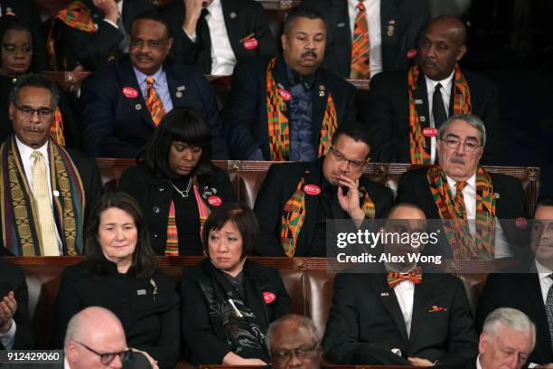 Members of Congress wear black clothing and Kente cloth in protest before the State of the Union address in the chamber of the U.S. House of...