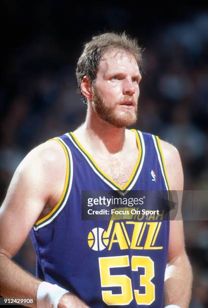 Mark Eaton of the Utah Jazz looks to looks on against the Chicago Bulls during an NBA basketball game circa 1989 at Chicago Stadium in Chicago,...
